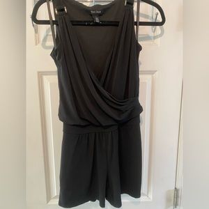 Black Romper with silver accents.  Deep V.  0